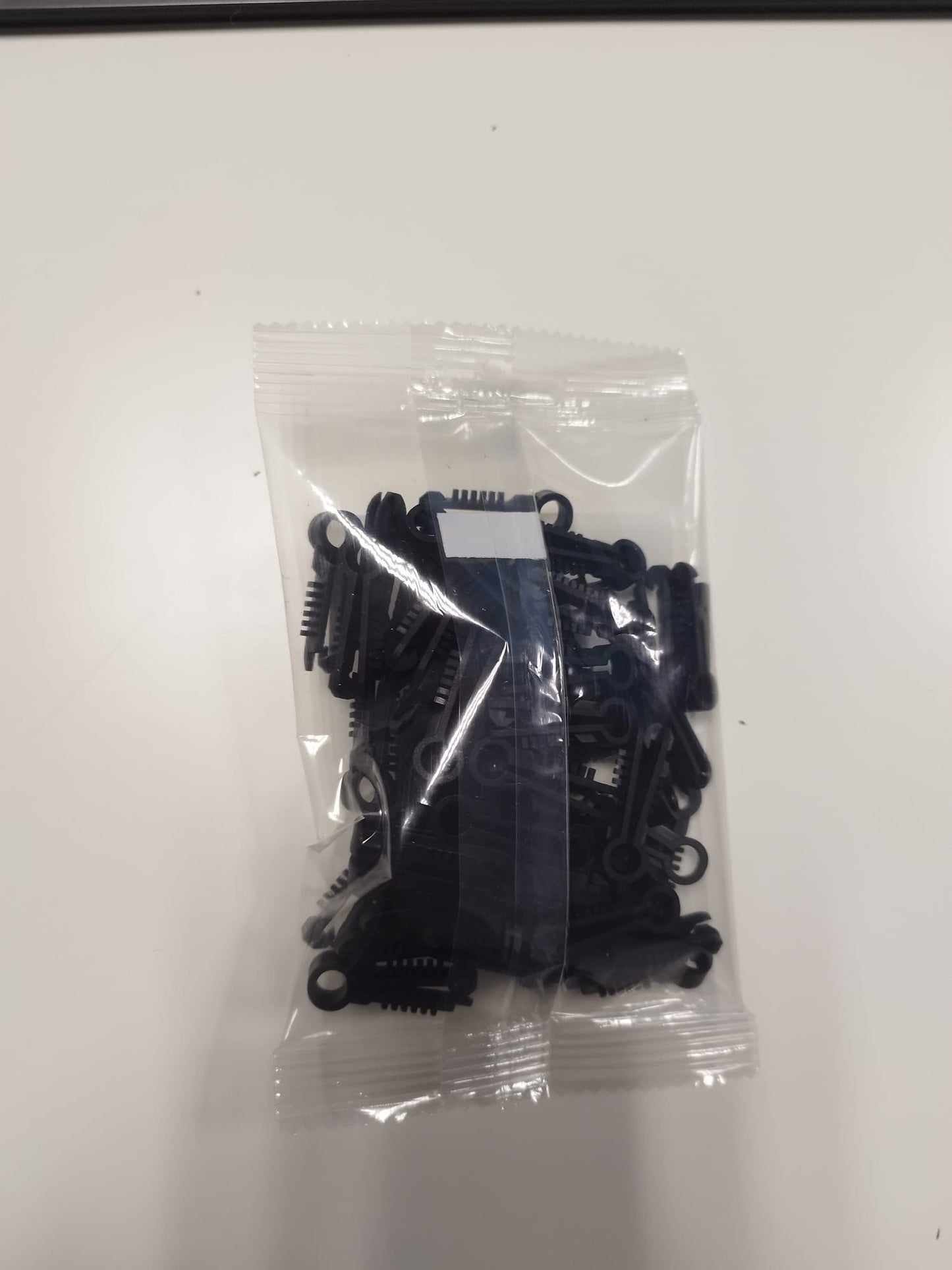 Pontet cheville rond noir (Lot de 100) Fiala